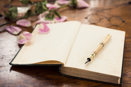 an open book and pen
