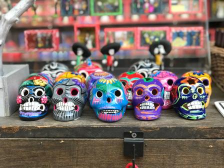 multi-color sugar skull figurines 