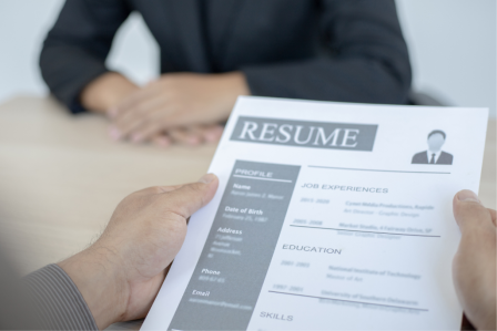 a person reading a resume during an interview