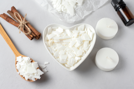 a heart shaped bowl with candle wax warming in it