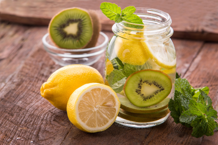 kiwis and lemons in a pitcher of water