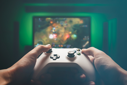 a first person point of view of someone holding a video game controller in front of the tv