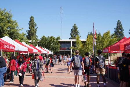 Turlock campus quad with people and tents