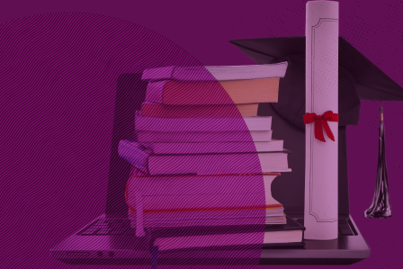 s stack of books next to a diploma scroll