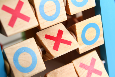 tic taco toe x's and o's on wooden blocks. 
