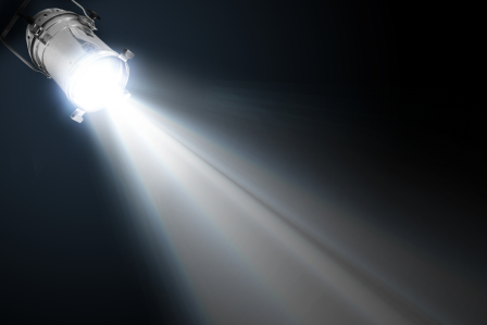 a spotlight shining on a black background