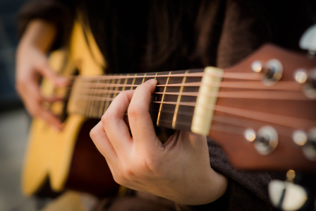 a person playing guitar