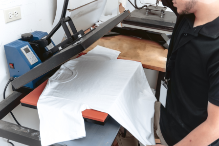a t-shirt being pressed to add a design to it