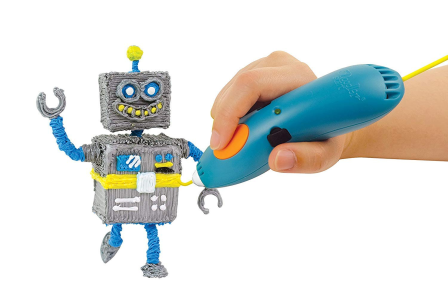 A hand using a blue 3D printing pen to create a small, colorful robot figure.