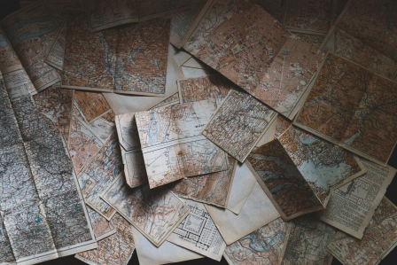 Maps scattered on a table