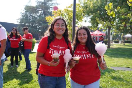 Two students wearing StanWeek shirts