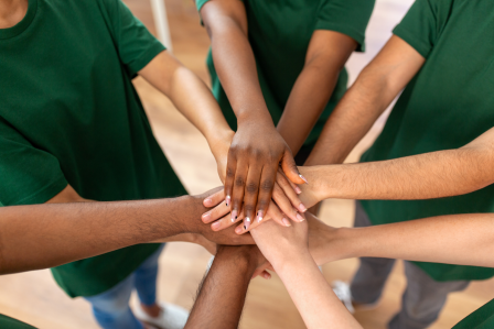 Volunteers holding hands
