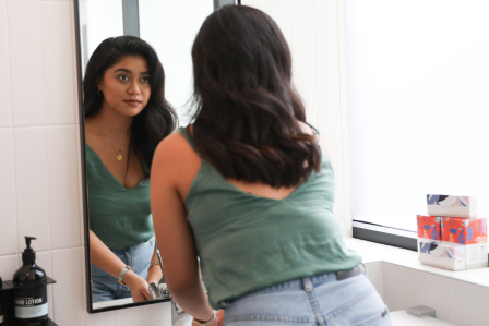 person in front of a mirror