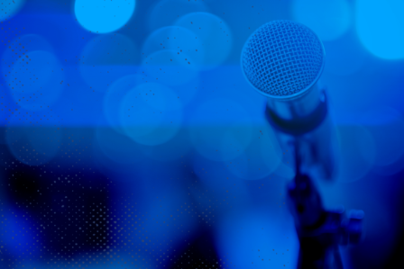 Microphone with blue background.