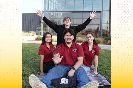 Four students in front of the University Student Center
