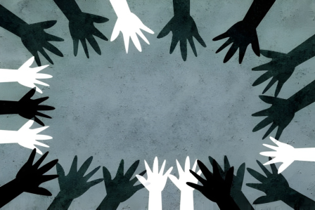 Hands of different skin tones forming a circle