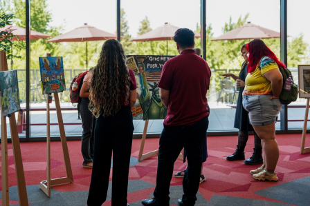 Students at an art exhibit