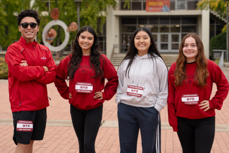 Four student participants from the Homecoming 5k in 2025 are seen in a group photo