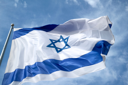 A flag of Israel waving in the wind.