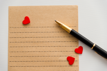 A lined piece of paper and a pen