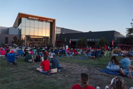 Students sitting on the Student Center lawn