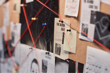 Pin board with crime solving material
