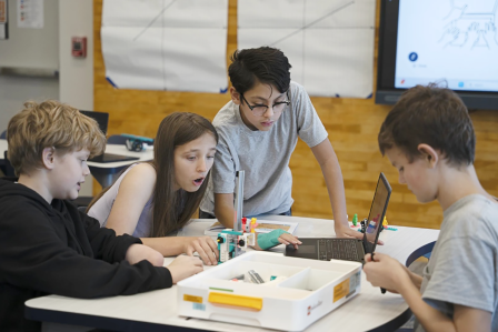 students working on coding lego project