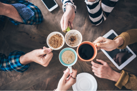People cheering their coffees together