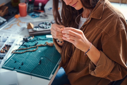 Person making a bracelet 
