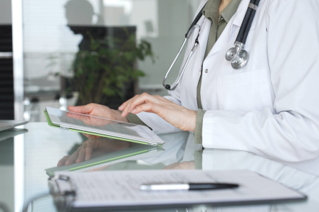 Person in healthcare with tablet in an office 