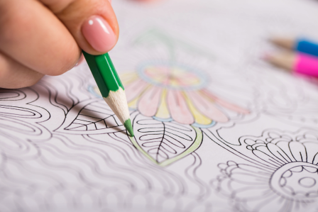 Person coloring a mandala 