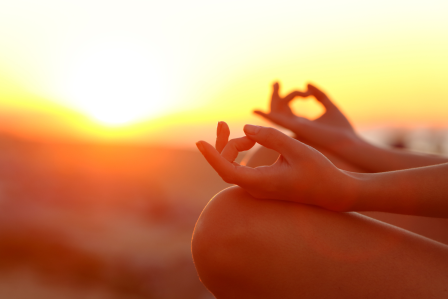 Yoga pose with a sunset