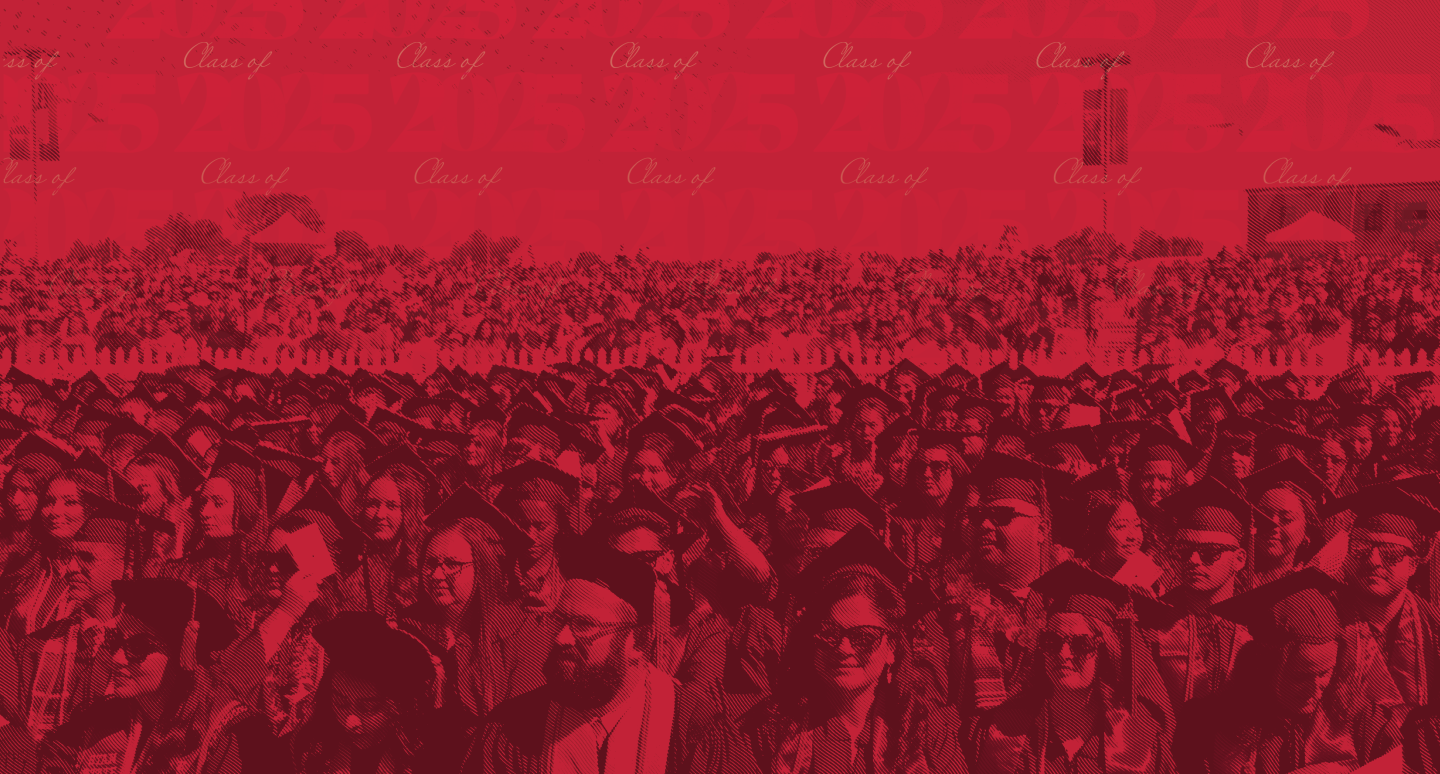 Looking out at a large group of graduates with a red overlay.