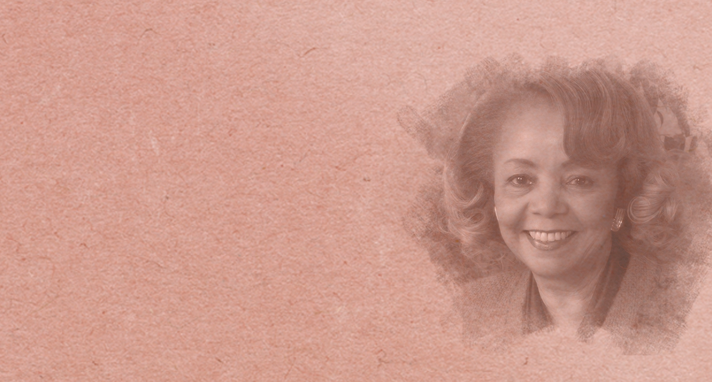 Sepia-toned image of an elderly woman with curly hair, smiling warmly. Her portrait fades into the textured background, conveying a nostalgic and gentle tone.