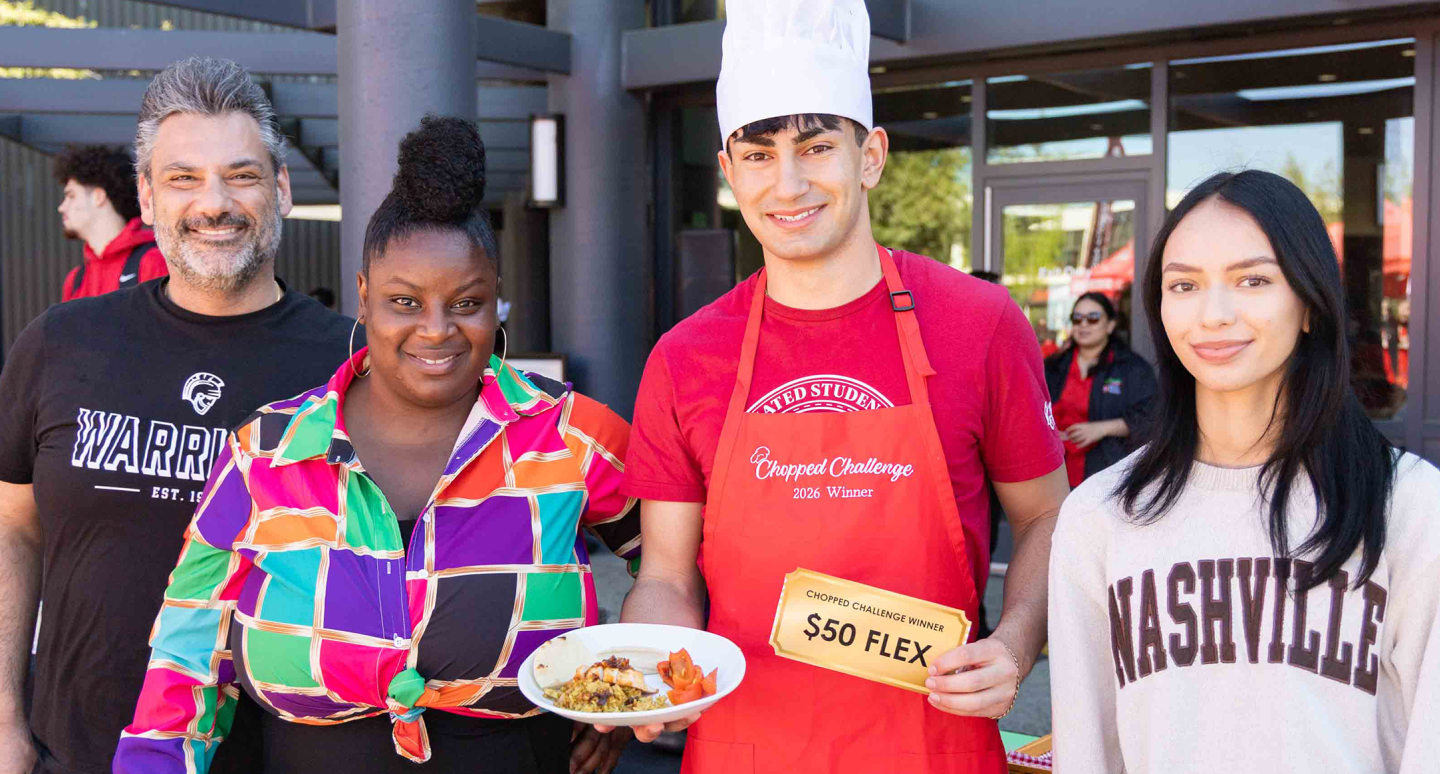 Four people smiling outdoors; a chef holds a dish and a "$50 Flex" prize card. The mood is celebratory with bright clothing enhancing the joyful atmosphere.