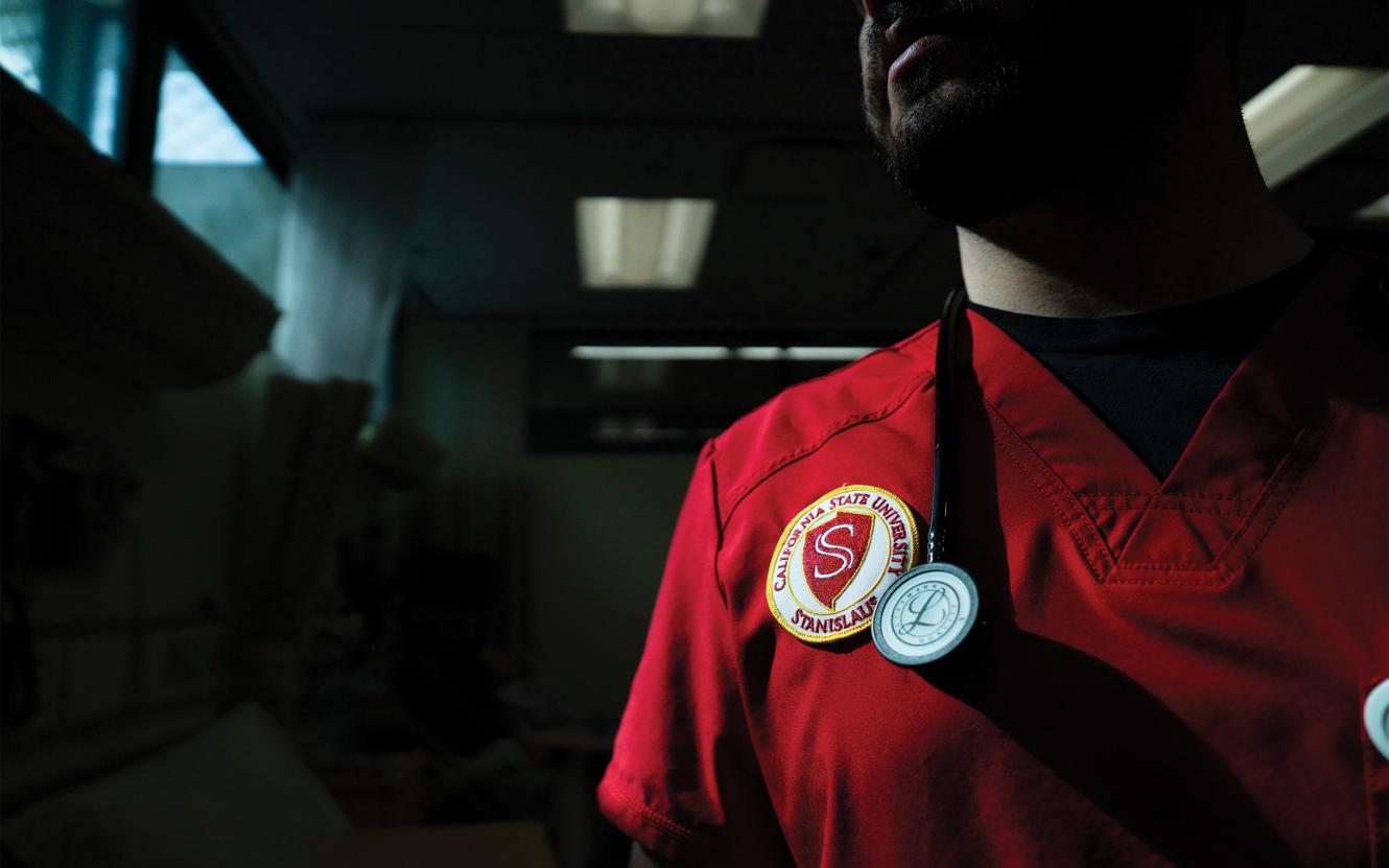 detail of University seal on nursing student scrub