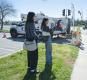 students covering newly activated red-light camera in Modesto