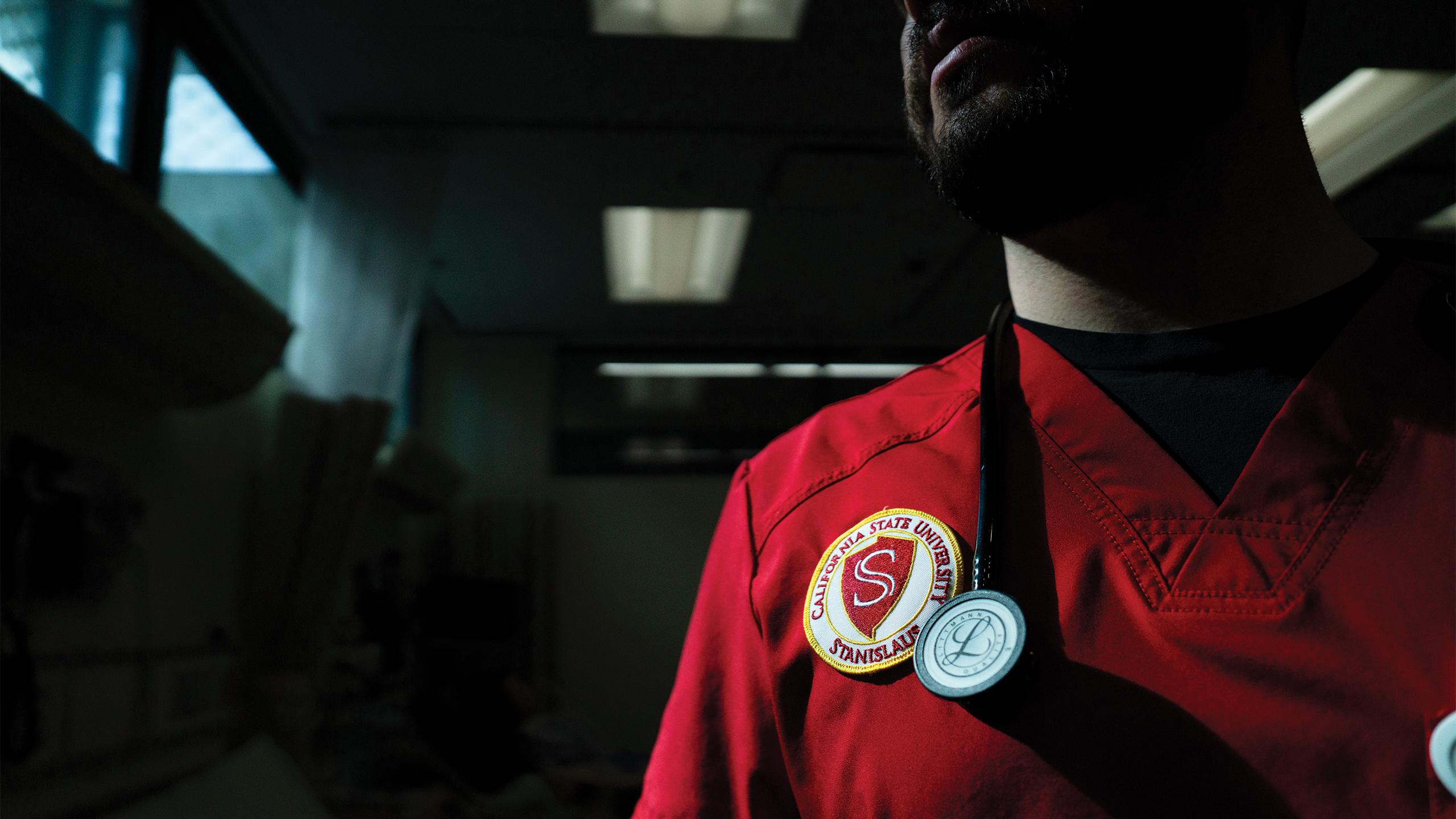 detail of University seal on nursing student scrub