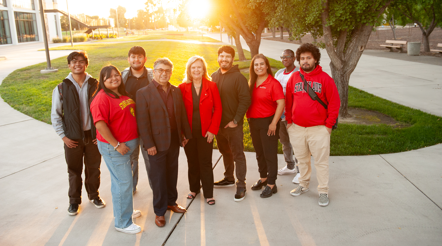 President Britt & Enrique Rios-Ellis with students