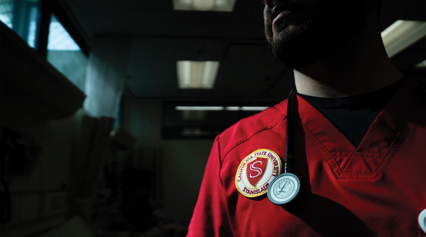 detail of University seal on nursing student scrub