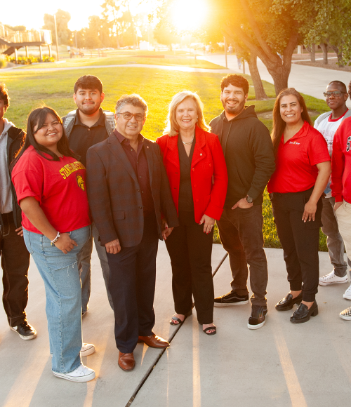 President Britt & Enrique Rios-Ellis with students
