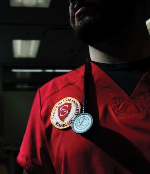 detail of University seal on nursing student scrub