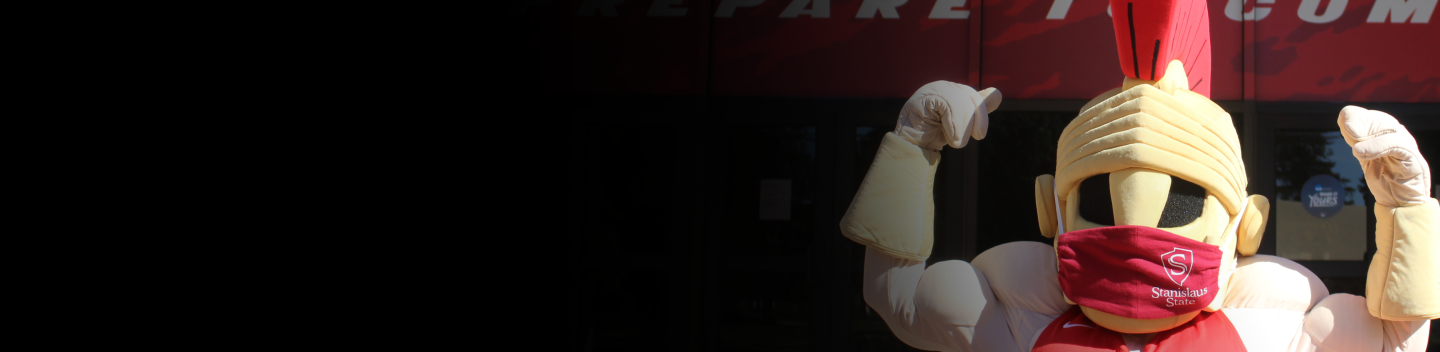 Titus wearing face covering