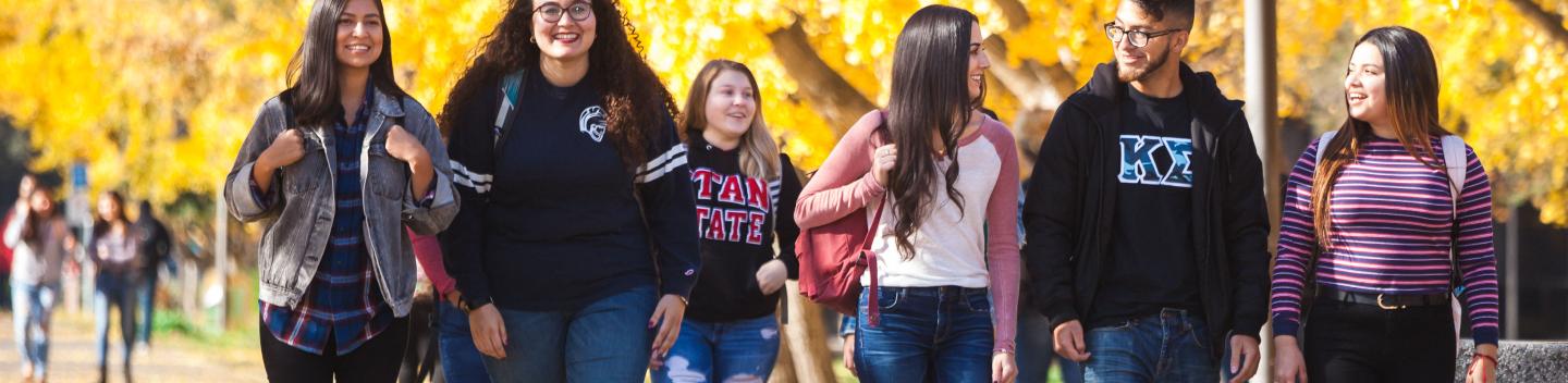 Stan State students walking on campus.