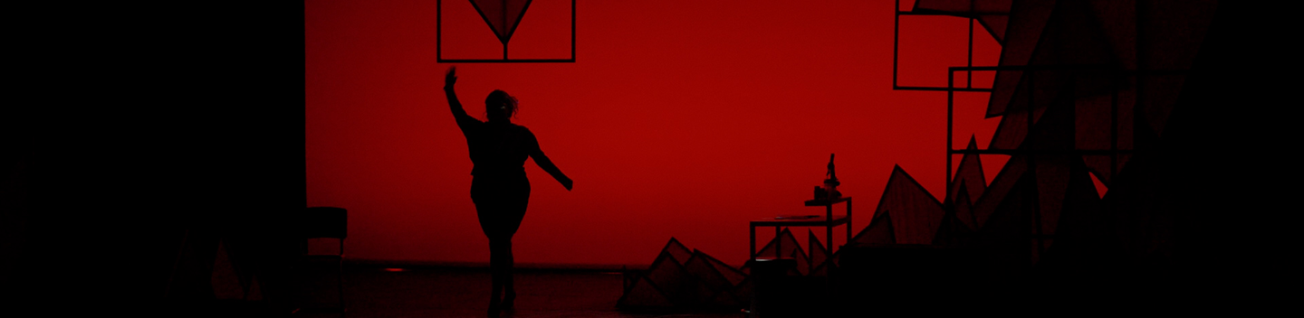 A lone performer on a stage.