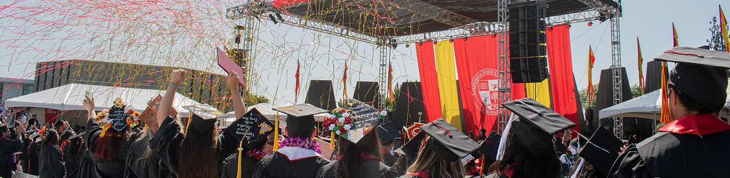Confetti rains down on graduates during Commencement.