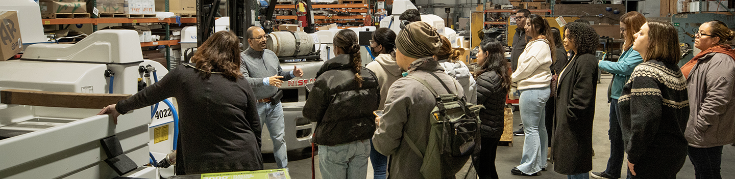 Students in a marketing class visit a warehouse.