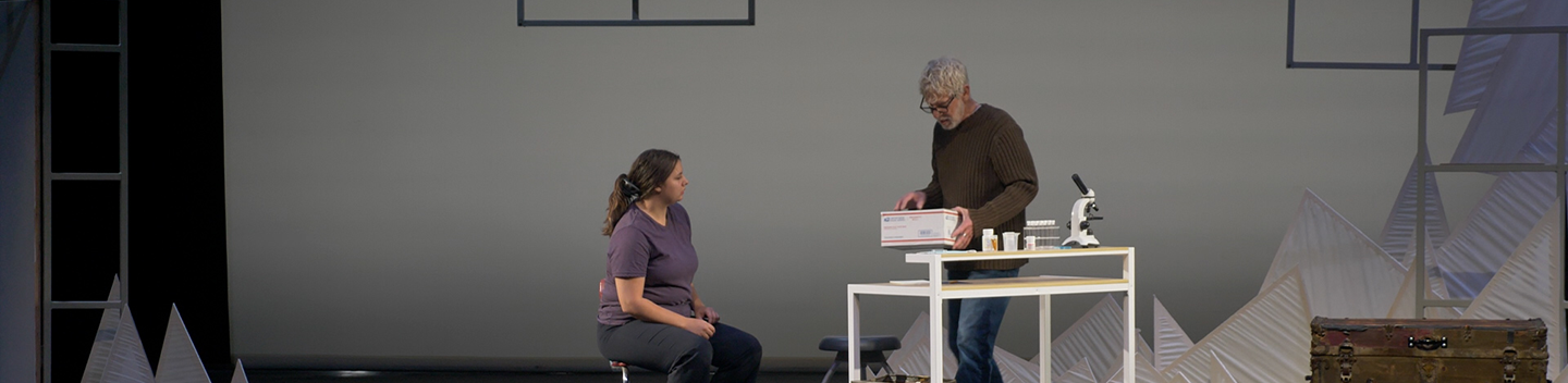 A woman and man perform a scene from the play "Hedda on Fire."