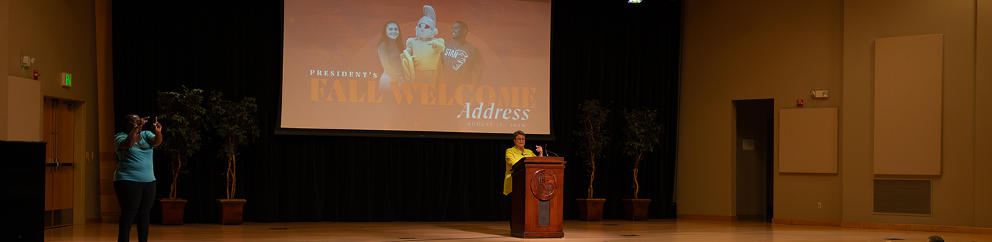 Interim President Sue Borrego on stage in Snider Recital Hall delivering the 2023 Fall Welcome Address.