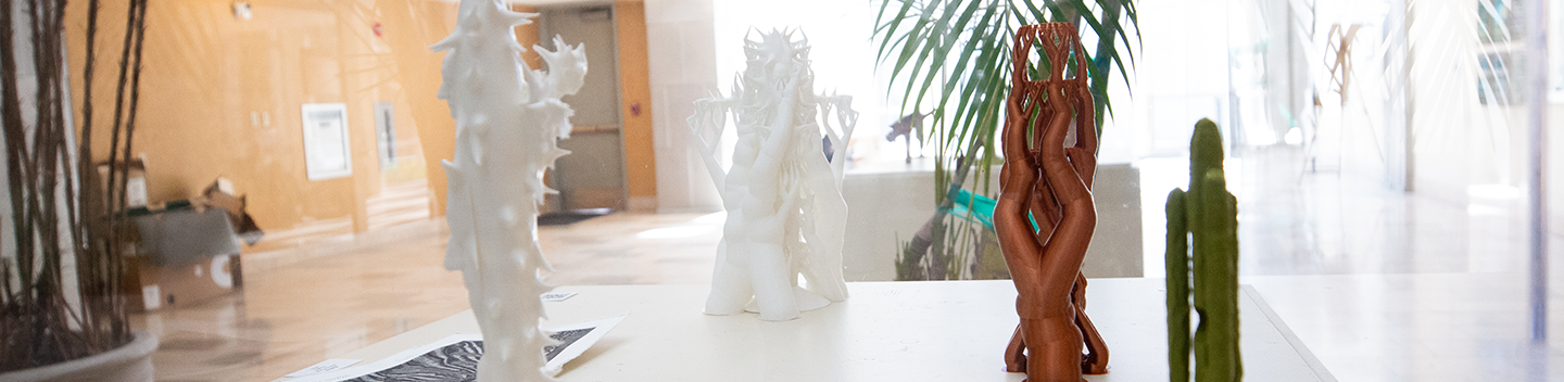 Metal sculpture on display in a case inside of Stanislaus State's Mary Stuart Rogers Building.